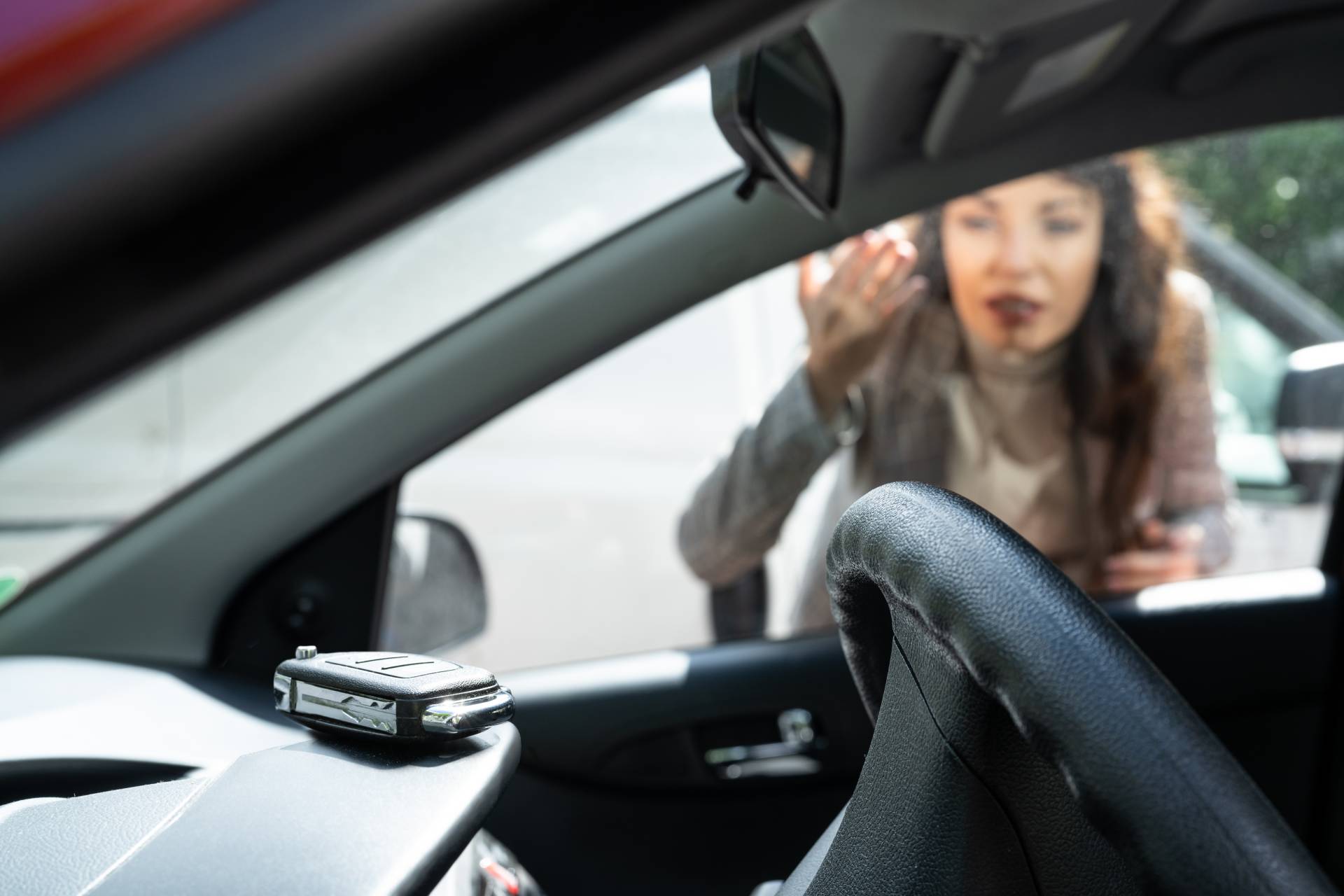 Locksmith cutting a car key